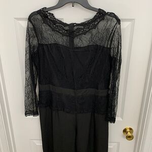 Size extra large black jumpsuit with lace/embroidery top and sleeves.